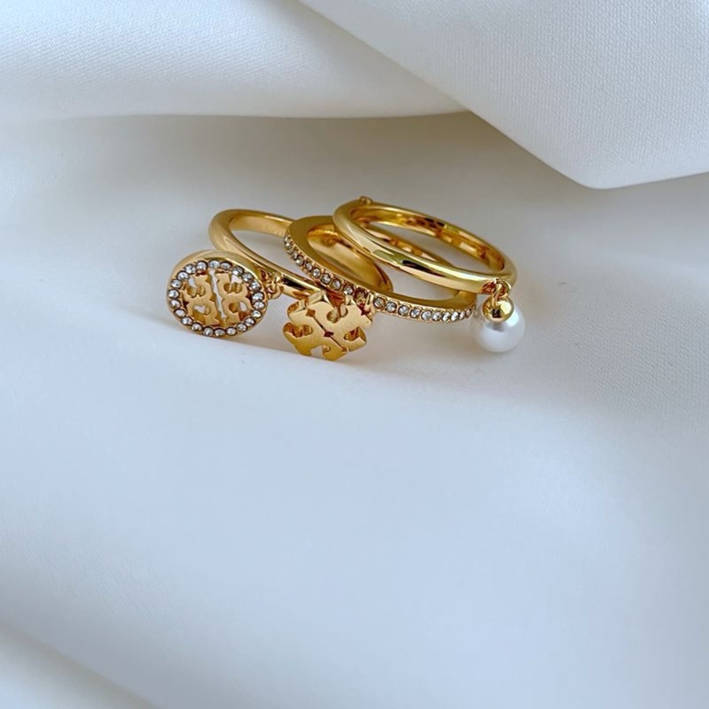 Tory Burch Elegant Gold and Pearl Ring Set